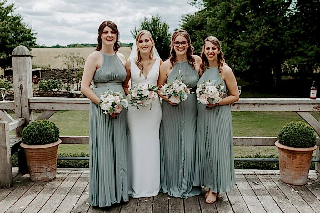 Bride and Bridesmaids holding florals