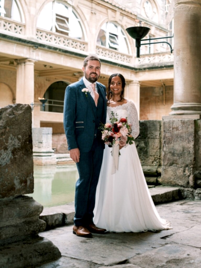 Bride and groom at Roman Baths having just tied the knot