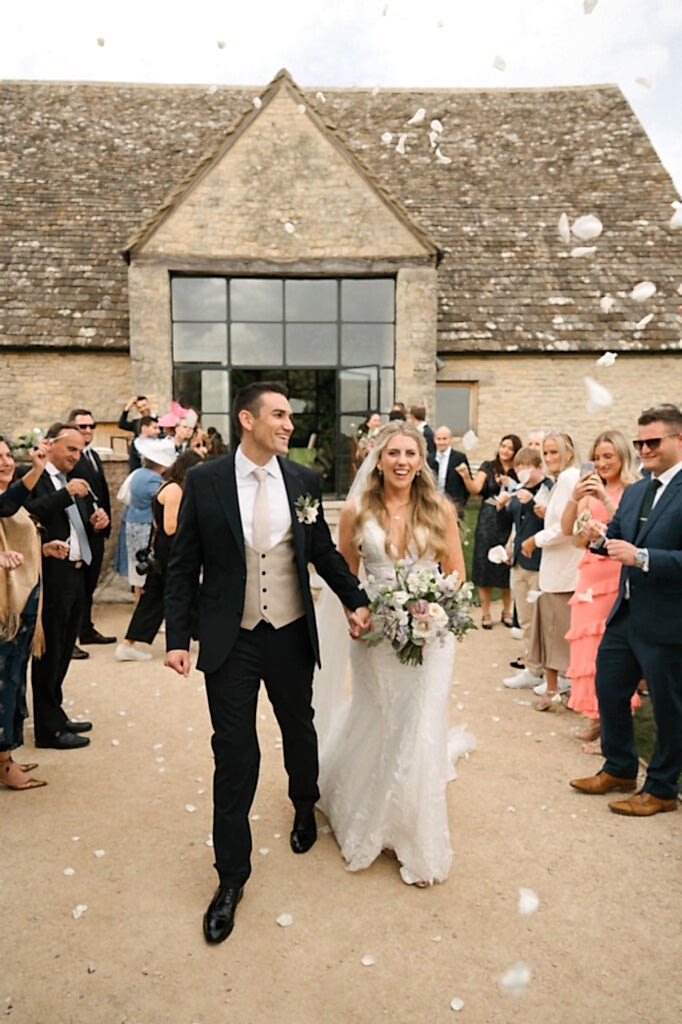 Bride and Groom being showered in confetti after the ceremony